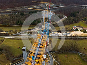 Aerial of a complex new railway bridge construction between two tunnels