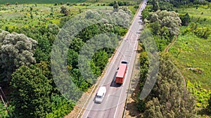 Aerial. Countryside highway traffic with truck and lorry. Top view