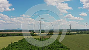 Aerial crane shoot of wind power turbines farm neer Vienna in Austria.