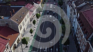 Aerial daytime view above downtown Cluj, Romania. Historical buildings and traffic. 21 December 1989 street