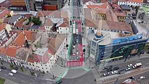 Aerial daytime view above downtown Cluj, Romania. Historical buildings and traffic. Ferdinand street