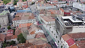 Aerial daytime view above downtown Cluj, Romania. Historical buildings and traffic. Ferdinand street