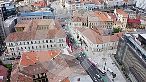 Aerial daytime view above downtown Cluj, Romania. Historical buildings and traffic. Ferdinand street