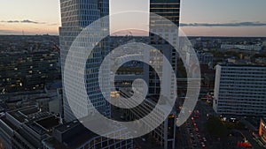 Aerial descending footage of modern buildings and urban borough at twilight in background. Charlottenburg neighbourhood