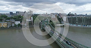 Aerial descending view of Hammersmith bridge and the river Thames in London