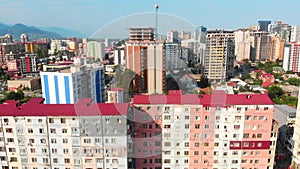 Aerial descending view new modern and old soviet type apartment neighborhoods in Batumi summer resort. Batum City development and