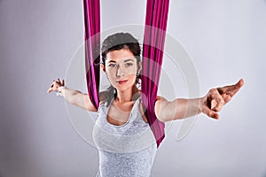 Aerial different inversion antigravity yoga in a hammock