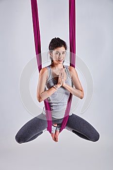 Aerial different inversion antigravity yoga in a hammock