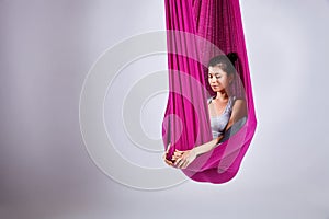 Aerial different inversion antigravity yoga in a hammock