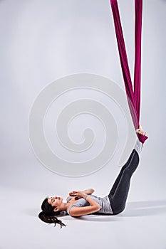 Aerial different inversion antigravity yoga in a hammock