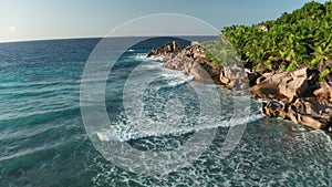 Aerial dolly over Grand l`Anse beach toward to Grand Cap, La Digue