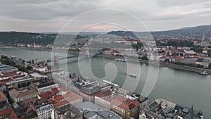 Aerial dolly shot of river cruise ships, Castle Hill, Buda Castle, Gellert Hill