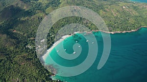 Aerial dolly tilt down over Anse Lazio beach at high altitude, Praslin