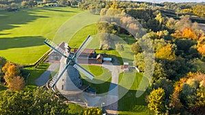 Aerial drone beautiful view on old traditional windmill in middle autumn. Germany  rural landscape in sunny evening