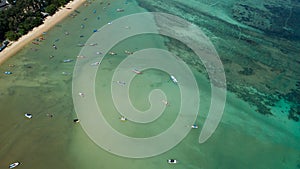 Aerial drone bird`s eye view photo Top down of tropical sea with long tail fishing boats at phuket thailand Amazing tropical sea