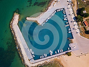 Aerial drone bird`s eye view photo of yacht harbor with calm waters, Greece