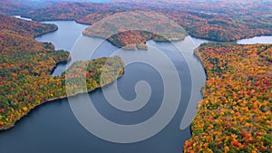 Aerial Drone Fall Foliage Fly Over New England Lake in Autumn Fly Up