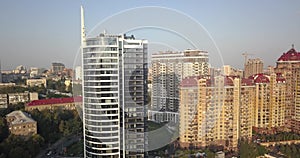 Aerial Drone Flight Footage: Picturesque view cityscape with glass business center in sunset light.Kiev Europe. 4k