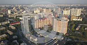 Aerial Drone Flight Footage: Picturesque view cityscape with glass business center in sunset light.Kiev Europe. 4k