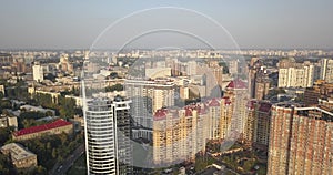 Aerial Drone Flight Footage: Picturesque view cityscape with glass business center in sunset light.Kiev Europe. 4k