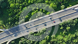 Aerial Drone Flight top down View of freeway busy city rush hour heavy traffic jam highway. Aerial view of the vehicular