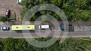 Aerial Drone Flight top down View of stuck cars and buses at rush hour heavy traffic jam.