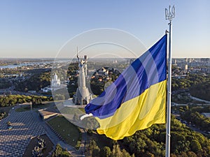 Aerial Drone Flyby Shot in Kyiv - Biggest National flag of Ukraine. Aerial view. Spivoche Pole, Kiev