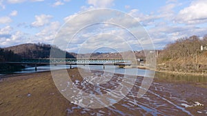 Aerial drone flying over low water level in Cheat Lake near Morgantown showing mud bank