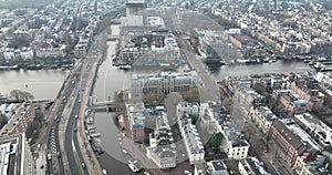 Aerial drone footage of the Amstel river and De Hogesluis (Brug 246) in Amsterdam East and city center downtown. Dutch