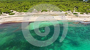 Aerial drone footage of the beach front on the Spanish island Majorca Mallorca, Spain showing the beach known as Platja de na