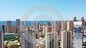 Aerial drone footage of the beautiful city of Benidorm in Spain in the summer time showing the Playa de Levante beach front and