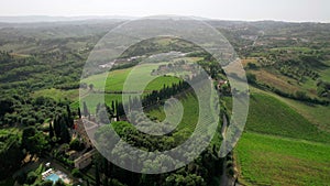 Aerial drone footage captures the breathtaking summer vista of an elegant villa.