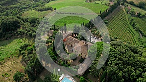 Aerial drone footage captures the breathtaking summer vista of an elegant villa.