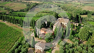 Aerial drone footage captures the breathtaking summer vista of an elegant villa.