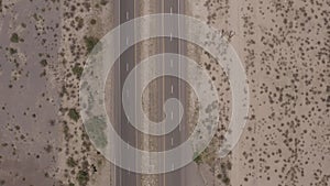 Aerial, drone footage of a desert highway near White Sands New Mexico