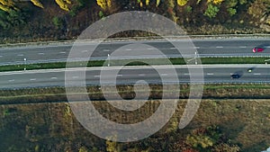 Aerial drone footage. Fly over autobahn near forest top view shot.