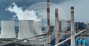 Aerial drone footage of a large coal power plant station with cooling towers chimney and boiler house in an air