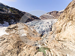 Aerial drone of Nigardsbreen glacier in Nigardsvatnet Jostedalsbreen national park in Norway in a sunny day