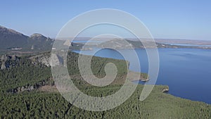 Aerial drone footage of rock remnant near the Lake Great Chebachye Lake in Natonal park Burabay Borovoe , Kazakhstan