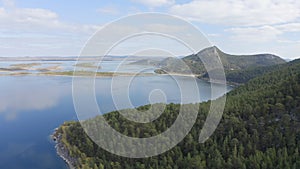 Aerial drone footage of rock remnant near the Lake Great Chebachye Lake in Natonal park Burabay Borovoe , Kazakhstan