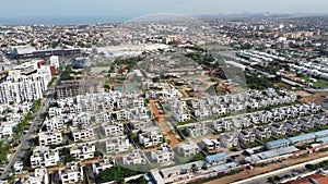 Aerial drone footage of Talatona city, residential area with condominiums with luxury houses and office buildings, metropolitan