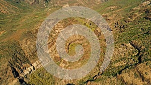 aerial drone image of beautiful stunning landscape view off the Degollada de La Yegua viewpoint with a valley with palm trees on a photo