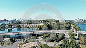 aerial drone image of montreal with bridges and a park area plus ile sainte helene island with the biosphere dome in the