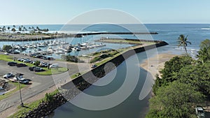 Aerial drone motion towards twin arched bridge over the river Anahulu in Haleiwa on Oahu