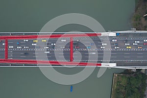 Aerial drone overhead shot of Caiyuanba Changjiang bridge on Yangtze River in Chongqing, southwest China