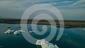 Aerial drone panorama of famous lake Joekulsarlon glacial lagoon and diamond beach with its icebergs