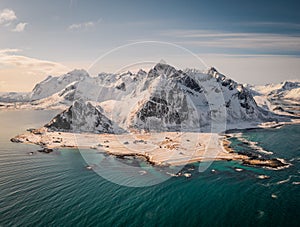 Aerial drone panorama view over flakstad. Beautiful mountains in winter wonderland north of norway. Peaceful and ambient aerial vi