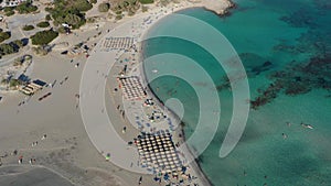 Aerial drone panoramic view video of famous exotic paradise sandy emerald beach of Elafonissi in South West Crete island, Greece.