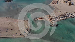 Aerial drone panoramic view video of famous exotic paradise sandy emerald beach of Elafonissi in South West Crete island, Greece.