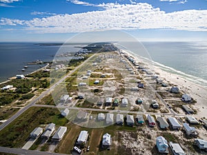 Aerial Drone Photo - Beach houses & oceans of the Gulf Shores / Fort Morgan Peninsula. Alabama